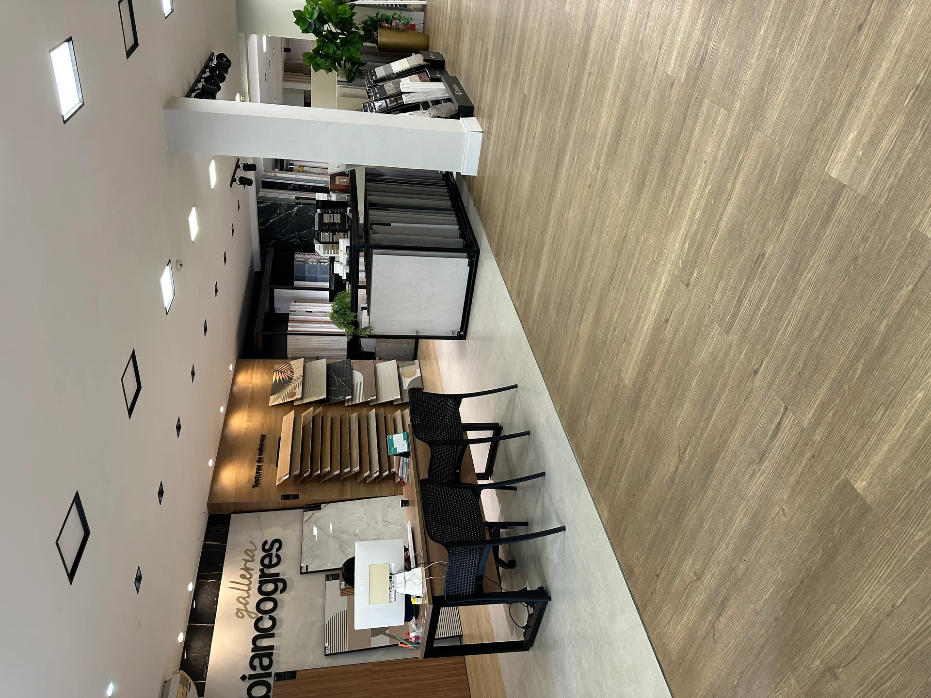 Team of business professionals collaborating in a modern office, representing the people and values behind StratEdge Consulting.