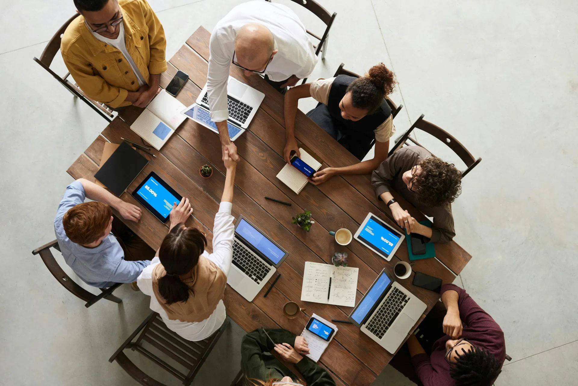Business professionals in a modern office discussing strategy, representing collaboration and expertise in consultancy services.